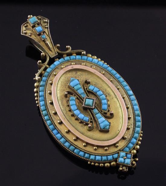 A Victorian Etruscan style gold and turquoise set oval pendant locket, 2.75in inc. bale.